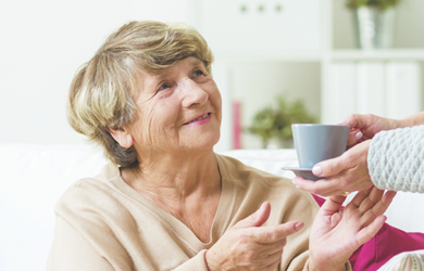 Lady receiving cup of tea 