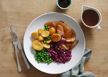 Roasted beef with gravy and vegetables
